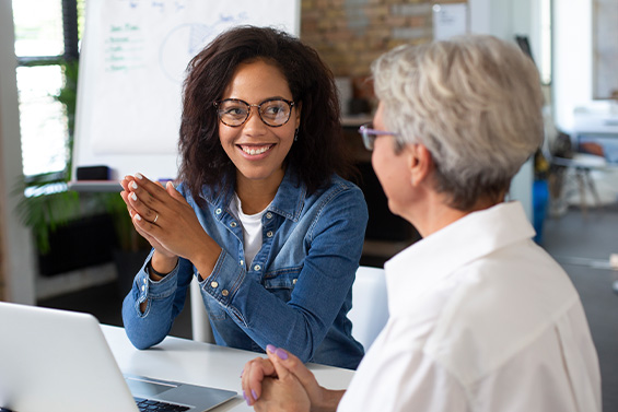 2 women in a business meeting in an office environment